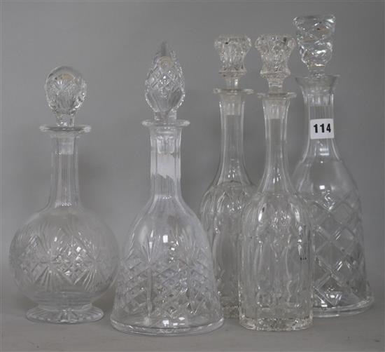 A pair of cut glass decanters and three others